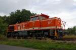 Die WLE 51  Kreis Warendorf  (Westf�lische Landes-Eisenbahn) eine MaK G 1206 steht am 17.09.2013 am einem Werksanschlu� in Burbach-Holzhausen.