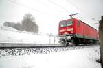 143 mit Nahverkehrszug im Schubbetrieb in Urspring am 13.02.2009.