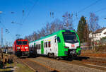Während links auf dem Stumpfgleis die 185 359-7 der DB Cargo AG wartet, rauscht rechts der für die DB Regio AG – NRW fahrende dreiteilige Stadler FLIRT 3 XL 3427 015 (94 80 3427 015-7