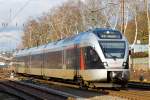   Der ET 232109  Kreis Siegen-Wittgenstein , ex ET 23009, ein 3-teiliger Stadler Flirt der Abellio Rail NRW hat gerade (am 17.01.2015) den Bahnhof Kreuztal verlassen und fährt weiter in Richtung