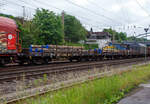 Vierachsiger Drehgestell-Flachwagen mit Drehrungen und Stirnwandklappen, jedoch ohne Seitenborde, 31 80 396 1 753-1 D-DB, der Gattung Rmms 664, der DB Cargo AG, beladen mit Rundstahl, am 03 Juni 2024