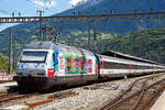Die SBB Re 460 099-5 „ Bodensee , Werbelok für die Mobiliar und Gottardo 2016,  am 20.06.2016 im Bahnhof Brig.