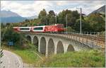 Kurz nach Segnas kommt bereits die MGB HGe 4/4 II N° 5  Mount Fuji  mit dem Glacier Express 902 aus Zermatt und konnte kurz vor der Einfahrt in den letzten Zahnstangenabschnitt auf dem Viadukt über das Val de Cuoz  fotografiert werden. 

16. Sept. 2020
