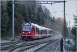 Der CJ Abe 4/12 erreicht auf seiner Fahrt von La Chaux de Fonds nach Glovelier den Spitzkehrbahnhof Combe Tabeillon.
