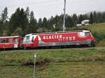 RhB Ge 4/4 III Nr.651 mit Werbung für Glacier-Express in Bergün am 29.08.2009.