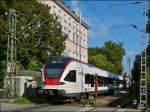 - Ein Sommerbild aus Konstanz - Der Seehas RABe 521 205 nach Engen hat soeben den B� Fischmarkt (km 414,0) passiert und f�hrt in Richtung Rheintorturm und Rheinbr�cke.