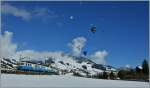 W�hrend der Himmel in Ch�teau d'Oex voller Ballone ist, f�hrt der MOB ABDe 8/8 mit Regionalzug 2221 in Richtung Montreux.